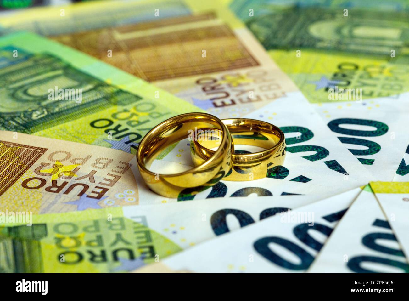 Wedding rings on euro banknotes Stock Photo