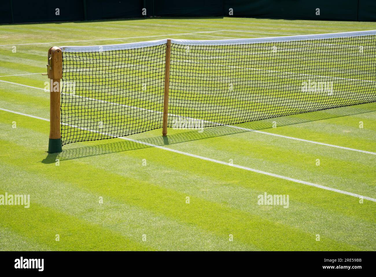 Lawn tennis court and net in sunshine Stock Photo Alamy