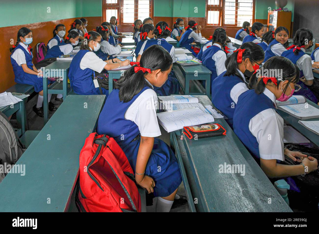 students seat at their desks inside class as they wait for their teacher at Nirmalabas High School in Imphal. Several students expressed hope that schools would remain open and wished for peace in the state of Manipur as the state has experienced periods of calmness following ethnic violence that first erupted on May 3. The situation remains tense, with clashes between Meiteis, Kukis, and security forces reported at regular intervals. One of the most serious impacts of the near outbreak in the state has been on education. (Photo by Biplov Bhuyan/SOPA Images/Sipa USA) Stock Photo