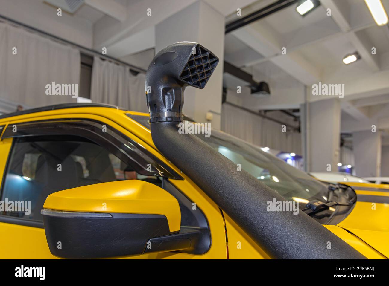 Black Snorkel Air Intake Pipe at Yellow All Terrain Vehicle Stock Photo