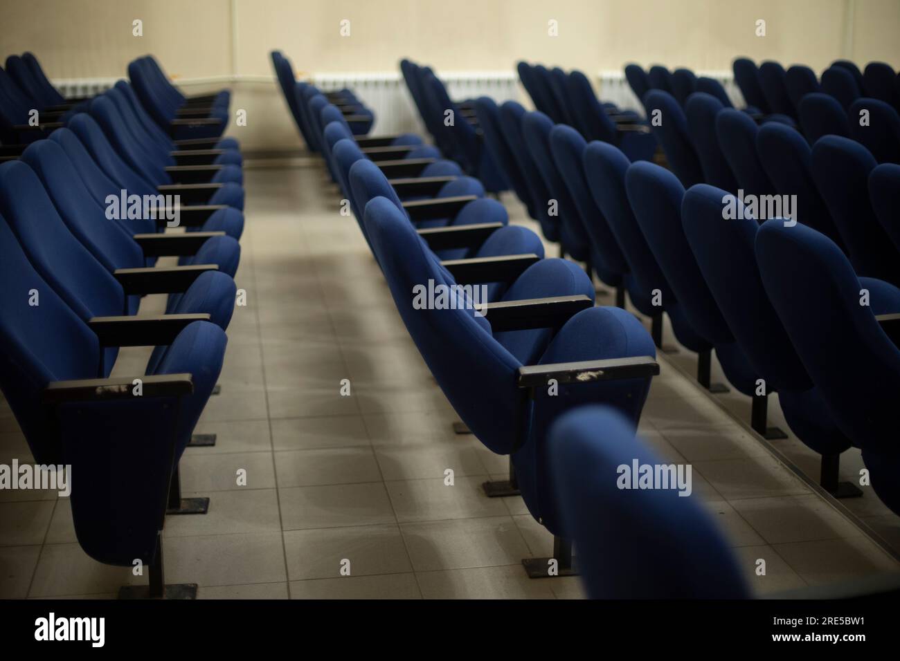 Blue seats in hall. Chairs in cinema. Place to watch movie. Blue
