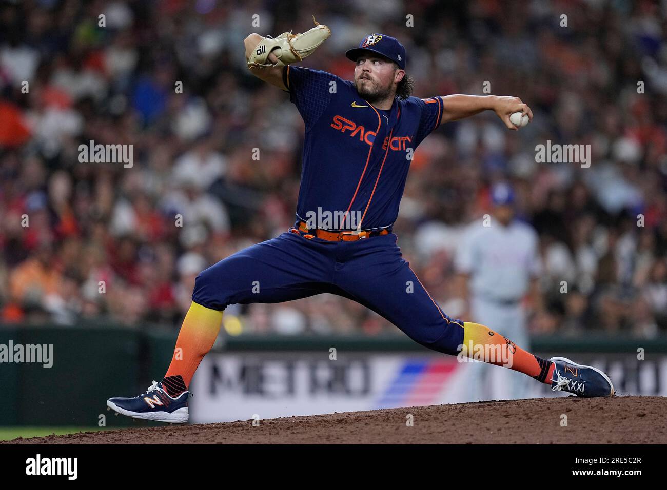 Houston Astros relief pitcher Parker Mushinski looks in at the