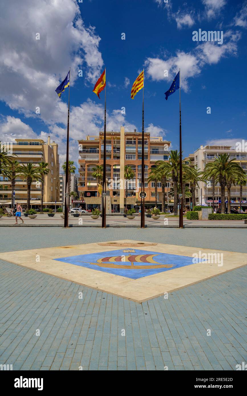 The square of the autonomous communities of Salou with the coat of arms of the city, the flags and the sculpture to James I of Aragon Tarragona, Spain Stock Photo