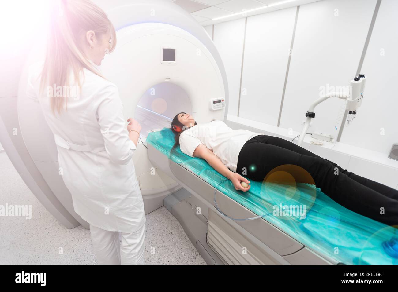 Female patient undergoing MRI - Magnetic resonance imaging in Hospital ...