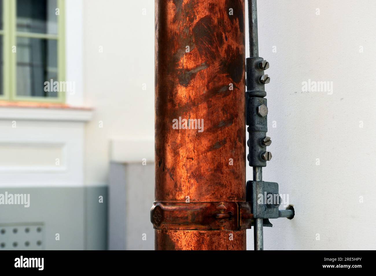 shiny new copper rain water leader, downspout or down pipe detail