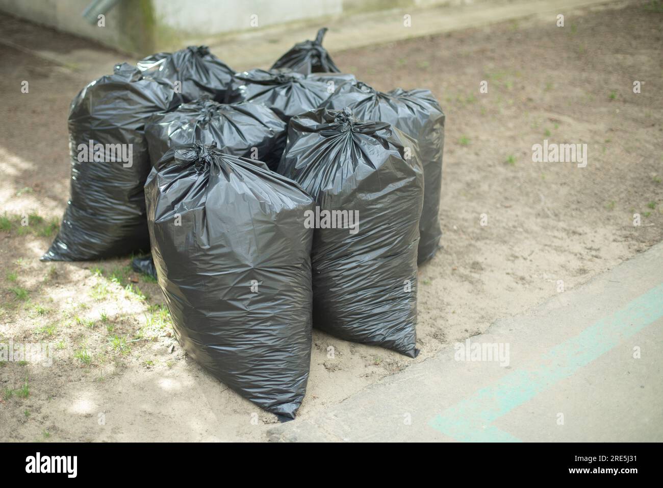 Black garbage bags. Waste bags. Cleaning on territory. Cleaning details