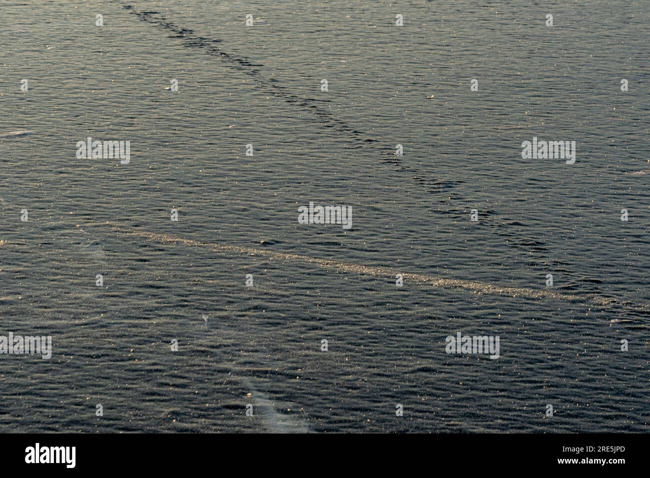 Natural rough frost-covered icy surface of the lake, sea. Beautiful ...