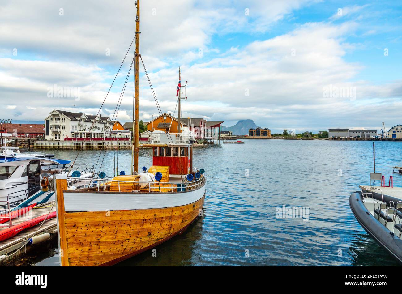 Yachts and boats with lagoon in the background at pier in Svolvaer, Lototen islands, Austvagoya, Vagan Municipality, Nordland County, Norway Stock Photo