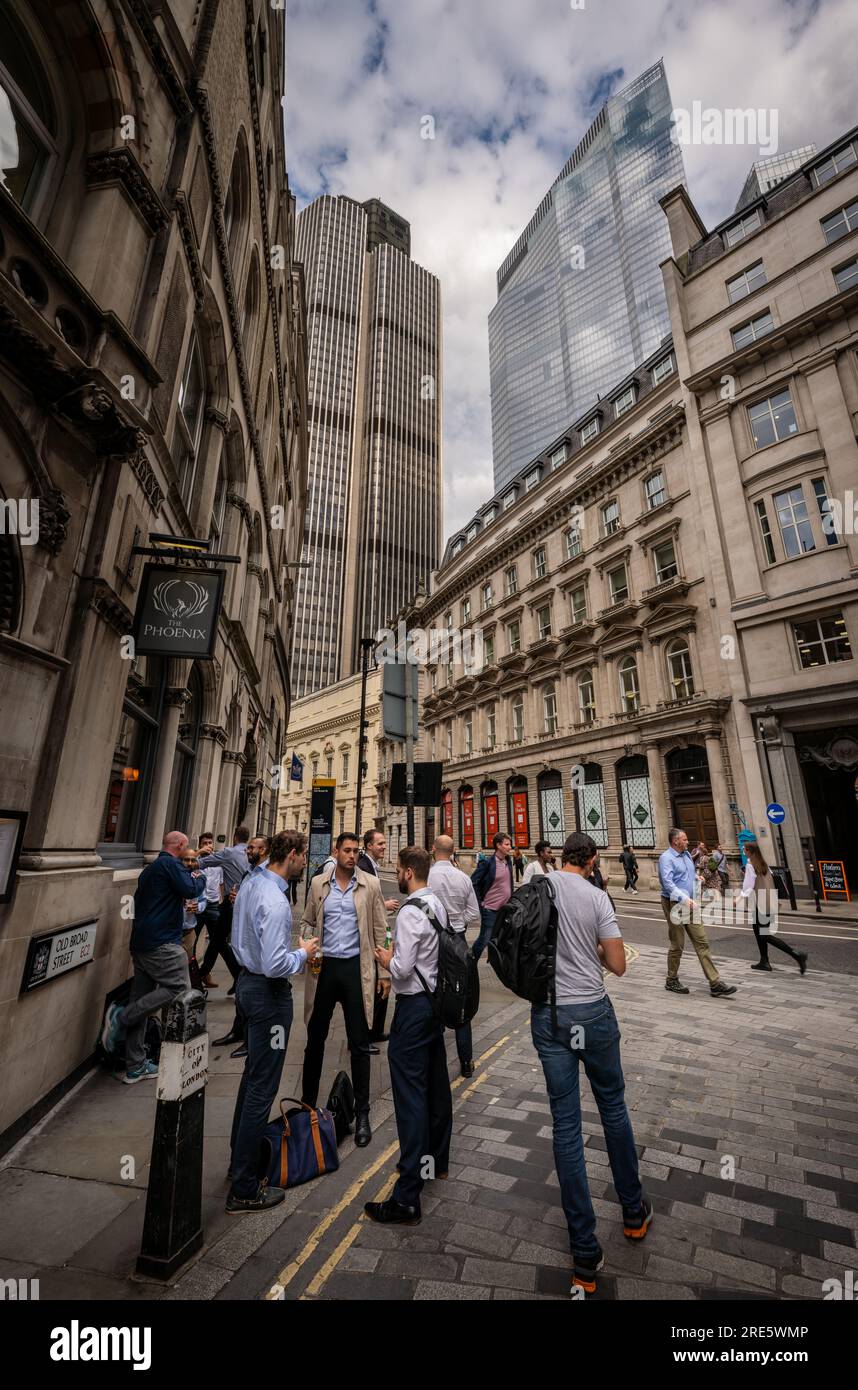 London, UK People outside The Phoenix pub on the junction of Old Broad