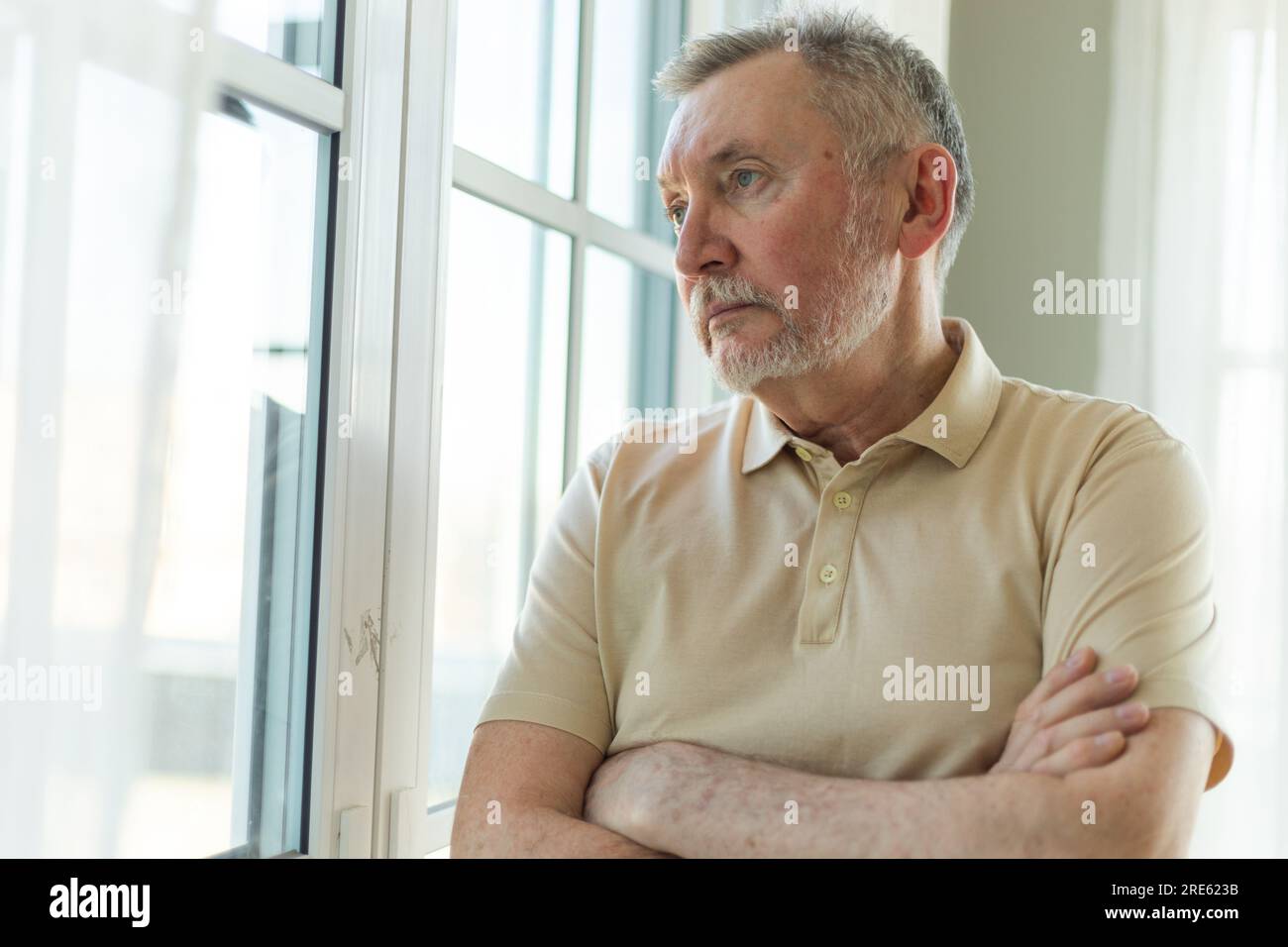 Sad tired lonely disappointed older senior man at home alone. Unhappy  grandfather looking sadly outside window experiencing grief relative death  bad news. Stressed elder man suffering from loneliness Stock Photo - Alamy