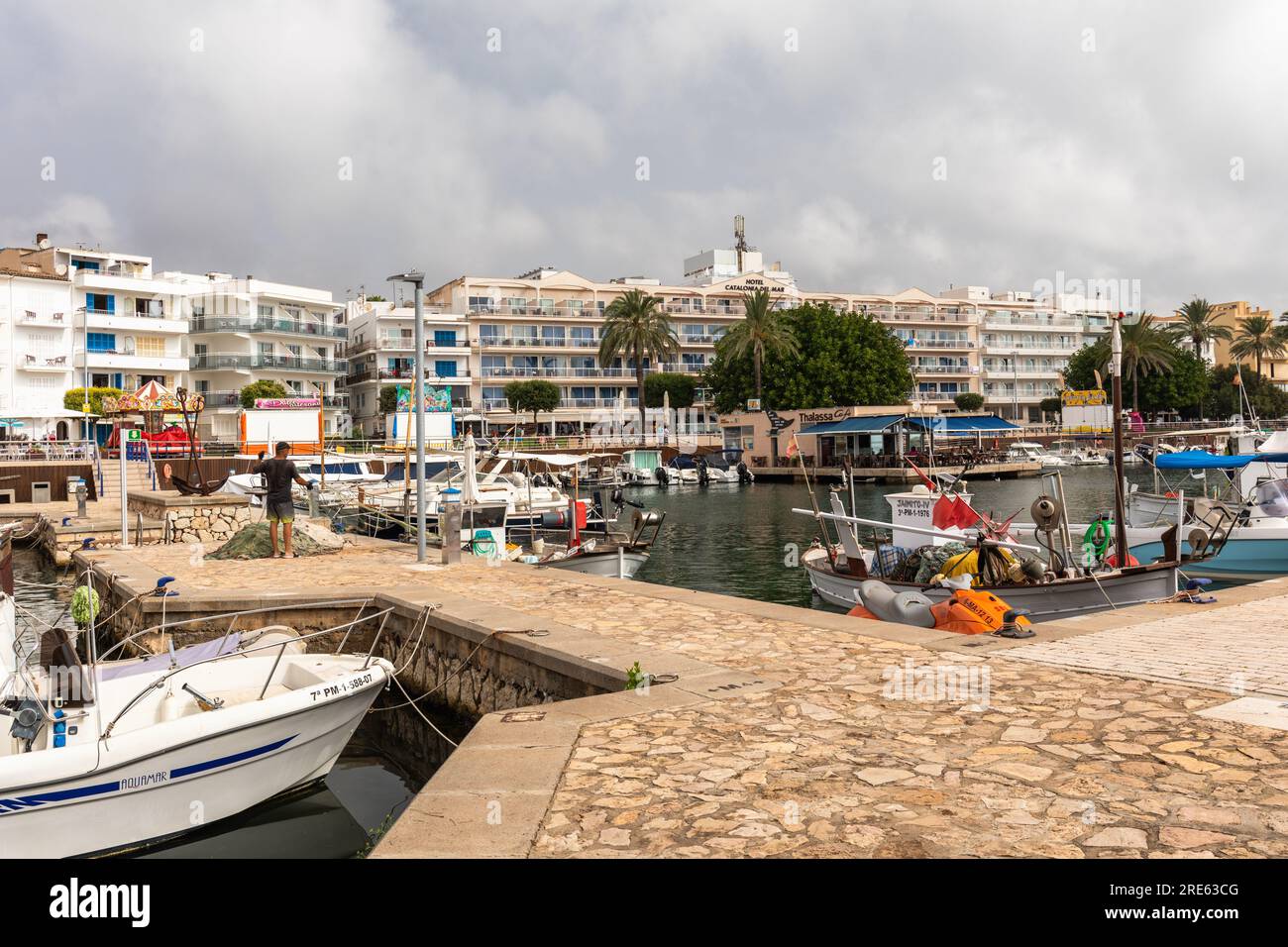 Cala Bona harbour with traditional fishing boats and surrounded by