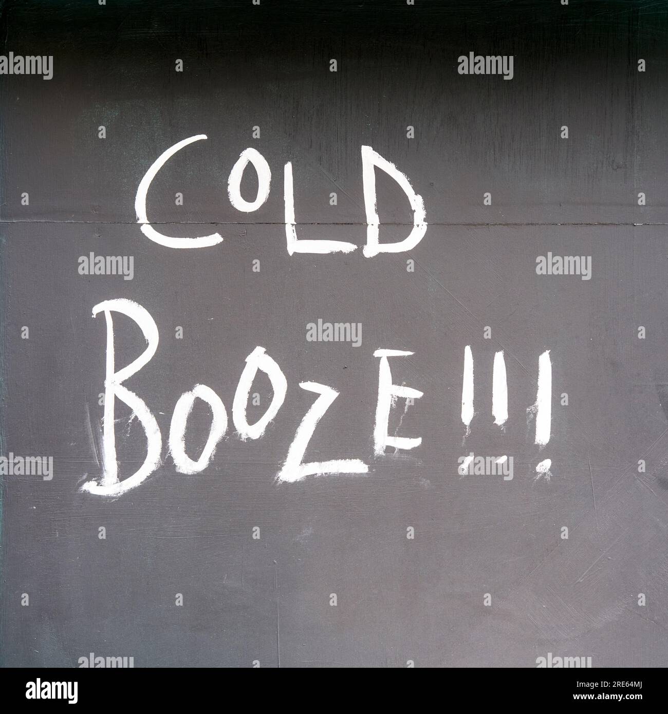 Cold booze written in white chalk on black board Stock Photo