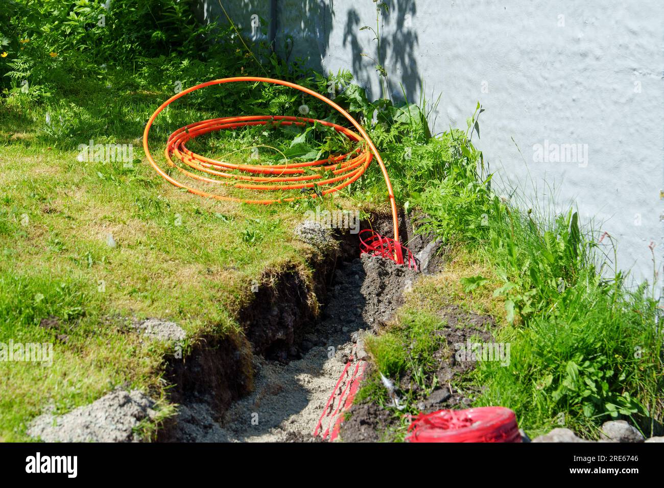 fiber optic cables been installed underground in dug trenches front of