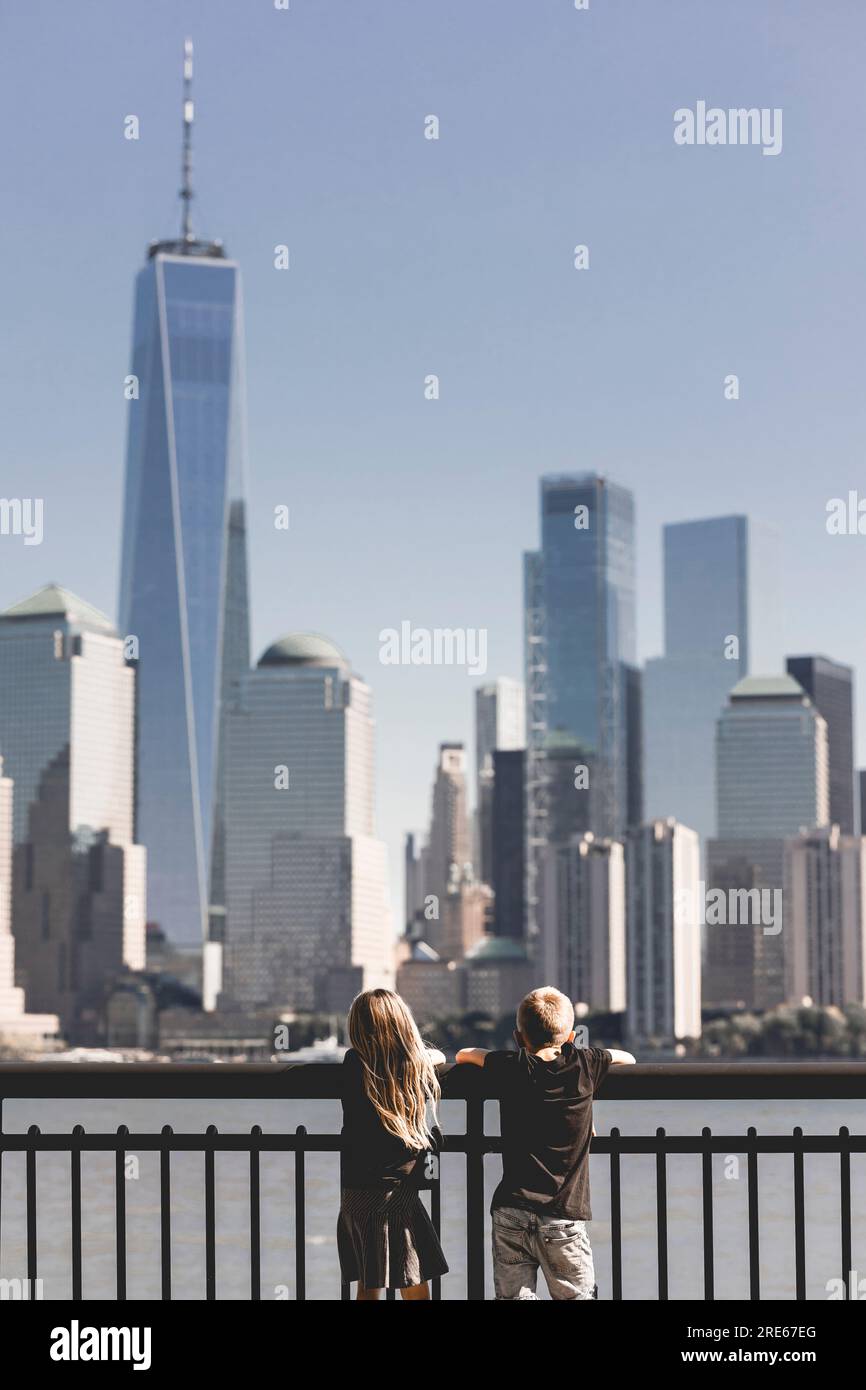 Children in front of New York skyline. View from New Jersey. Kids in front of New York skyline. Travel with kids. View to Manhattan from New Jersey. Stock Photo