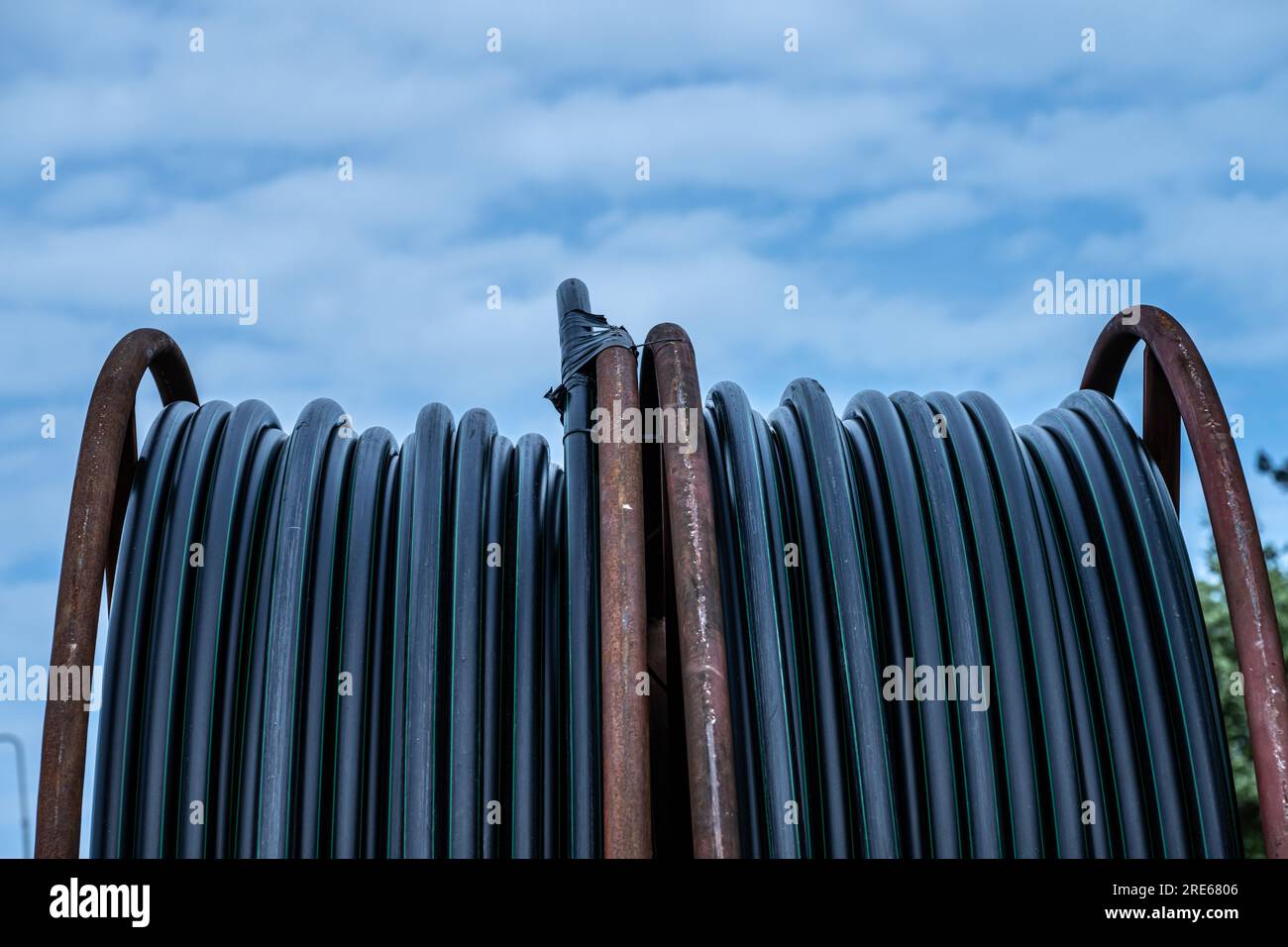 Cable drum containing a black cable Stock Photo