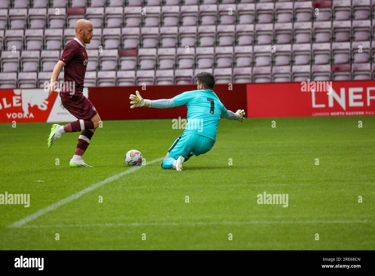 Tynecastle Park. Edinburgh, UK. 25th July, 2023. During the closed doors friendly between Heart of Midlothian FC and Mansfield Town FC Hearts Liam Boyce opens the scoring ( Credit: David Mollison/Alamy Live News Stock Photo