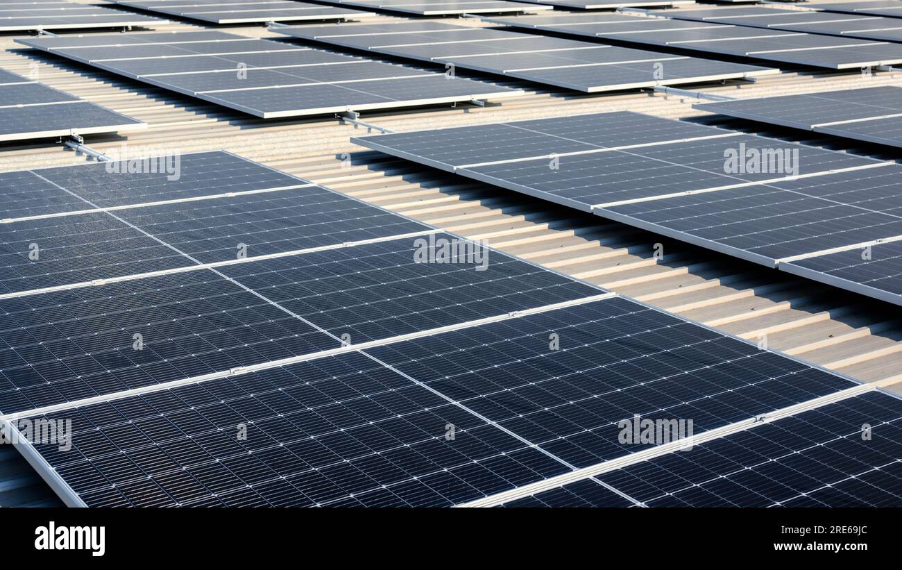 Blue photovoltaic solar panels on rooftop at solar cell farm Stock ...