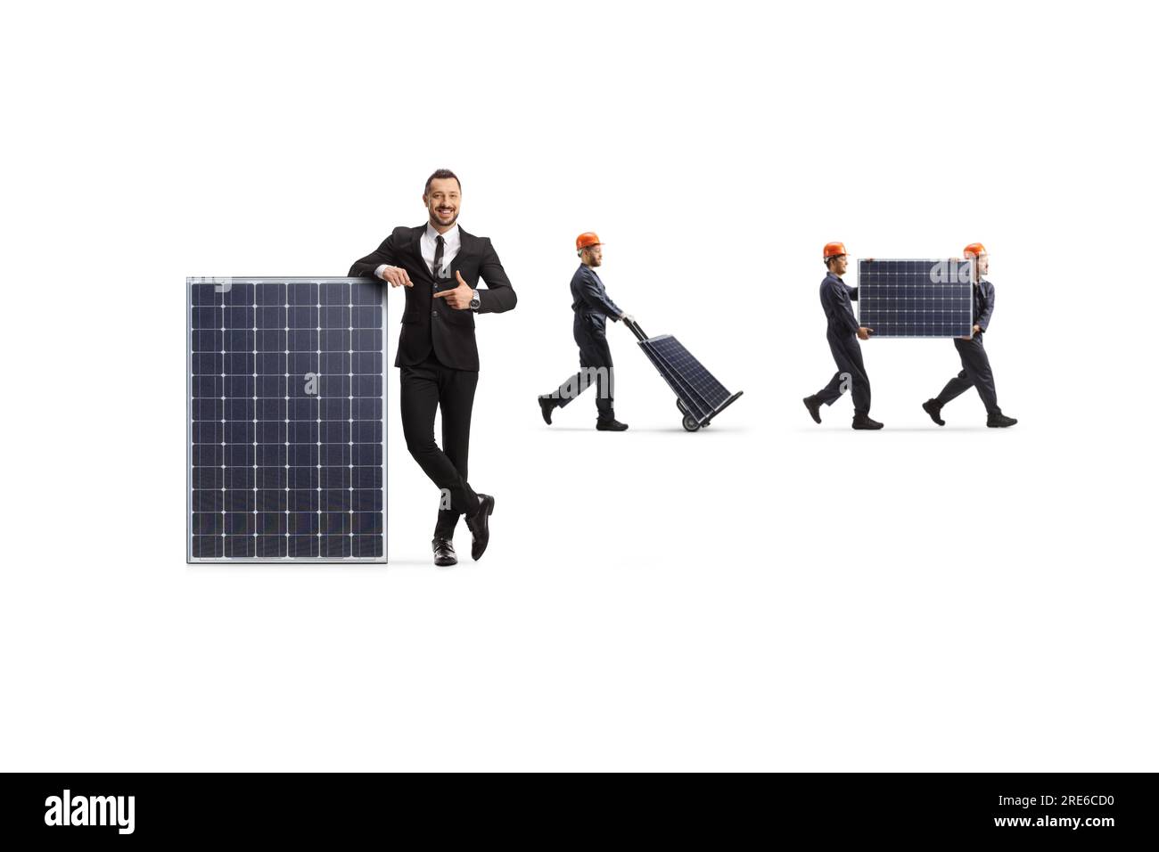 Businessman pointing at a panel and workers carrying photovoltaic panels isolated on white background Stock Photo