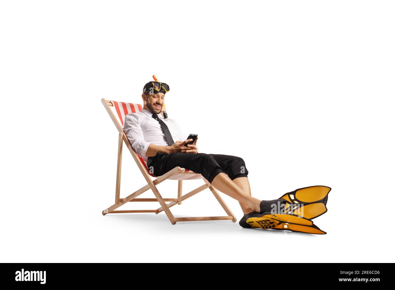 Businessman resting on a beach chair with a snorkel mask and fins isolated on white background Stock Photo