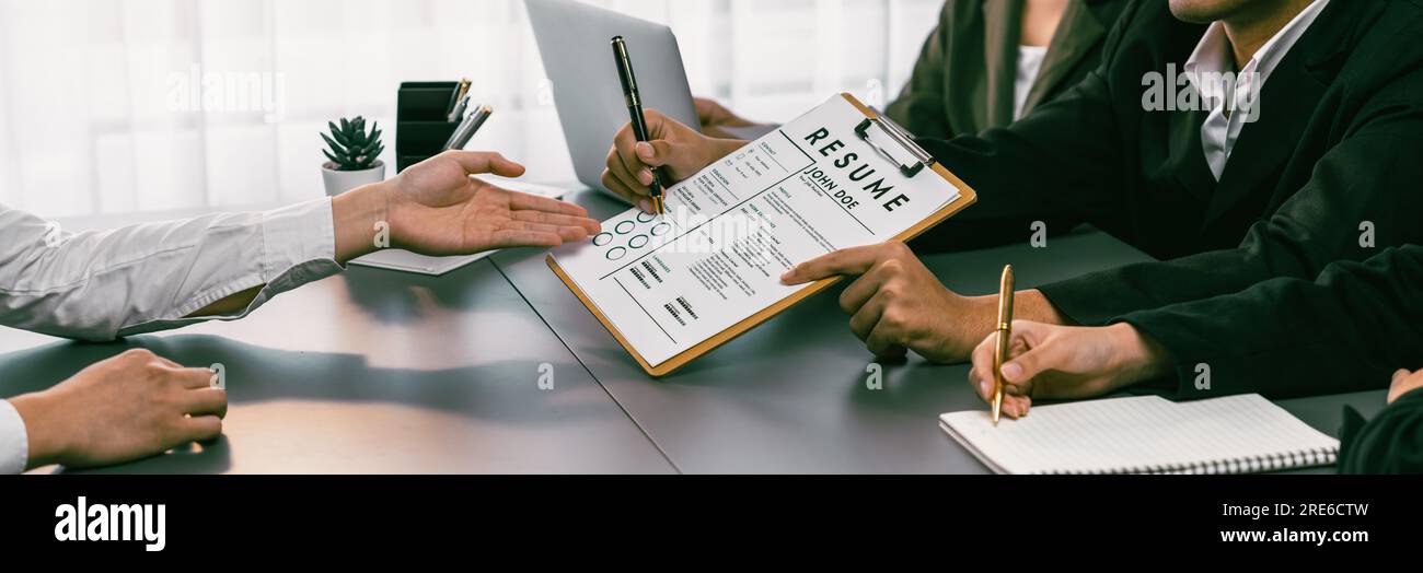 Candidate and interviewers discuss work experience and qualifications