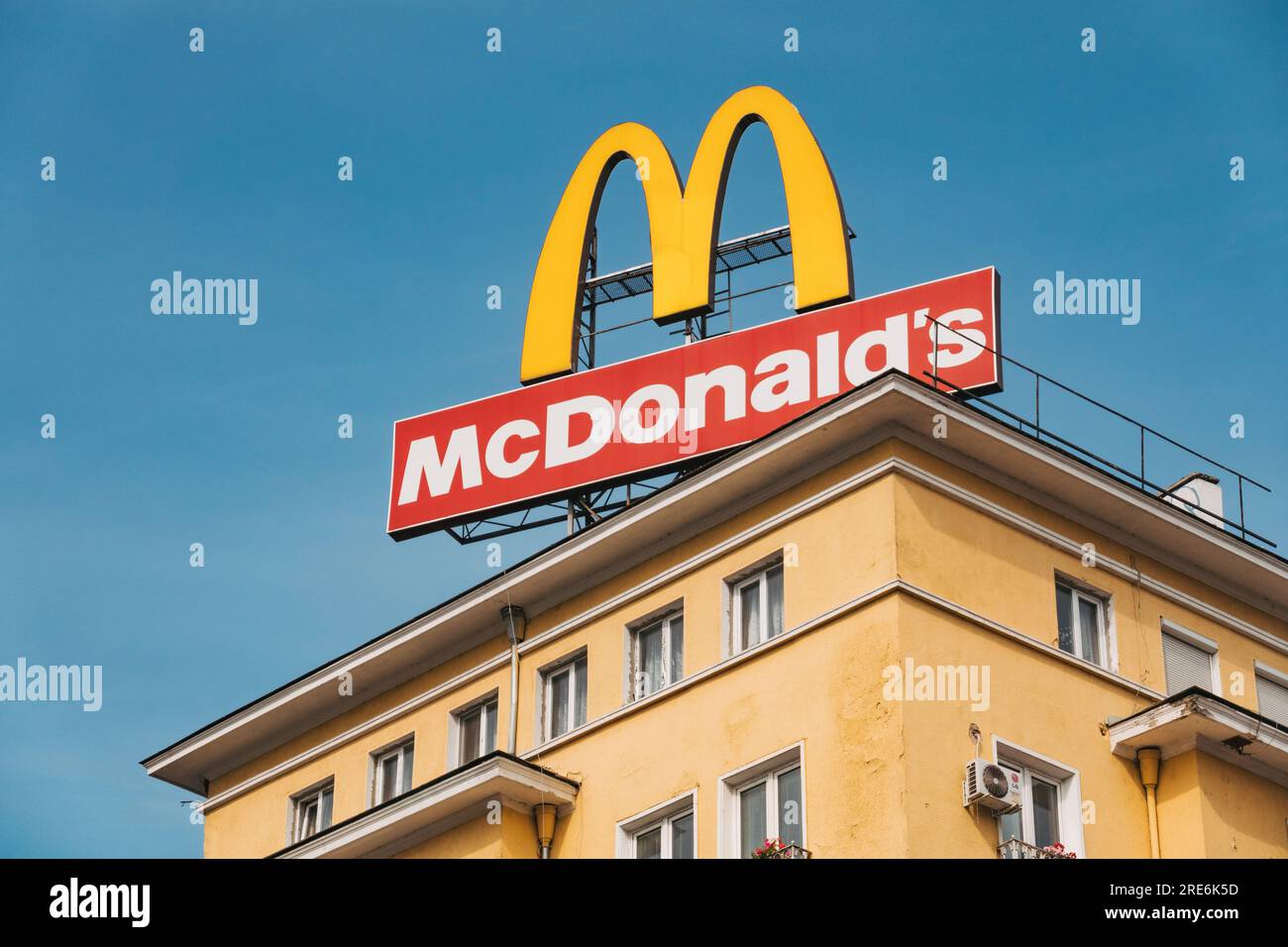 a large McDonald's sign on top of an apartment building in central Sofia, Bulgaria Stock Photo