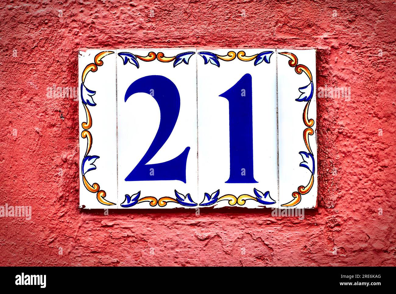 Number 21, twenty-one, decorative tiles with blue digits on bright red ...