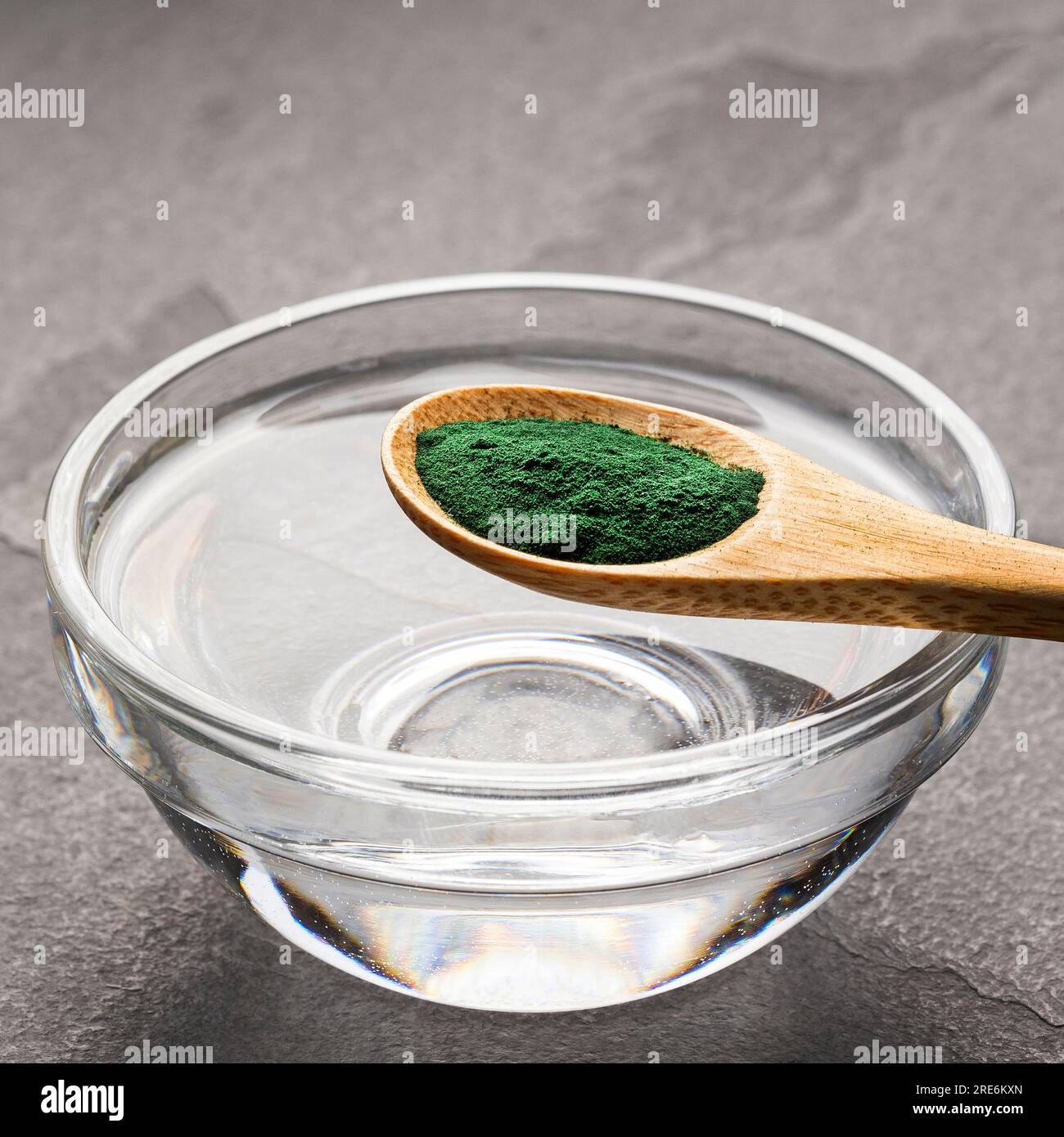 Spoon with spirulina algae powder to mix with water Stock Photo Alamy
