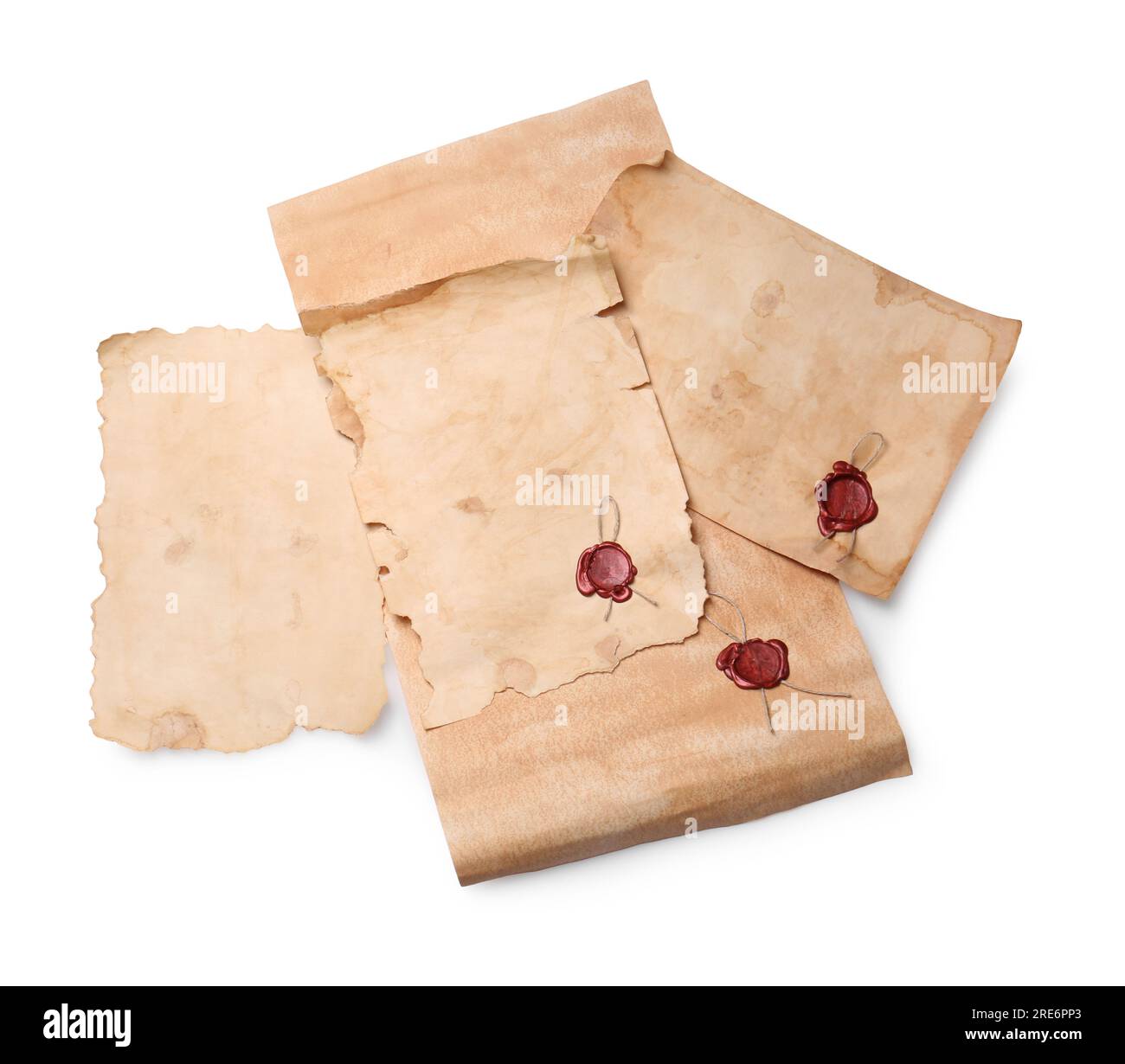 Sheets of old parchment paper with wax stamps on white background, top