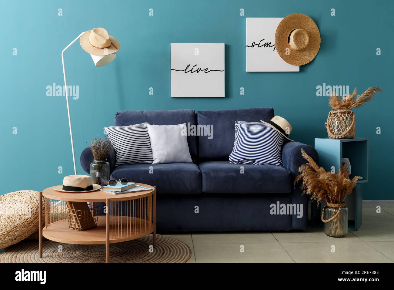 Interior of cozy living room with blue sofa and coffee table Stock ...