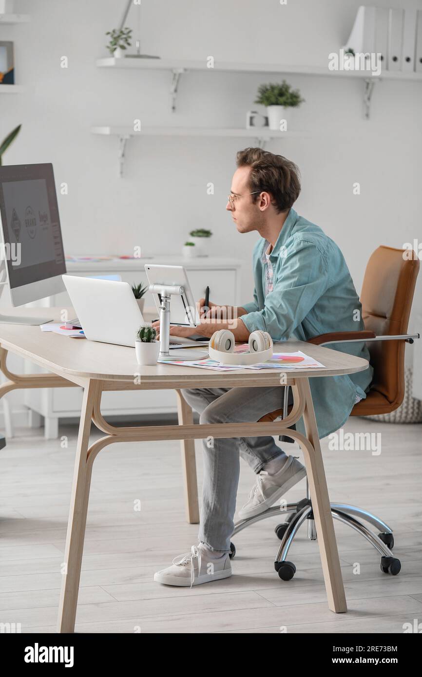 Male graphic designer developing logotype in office Stock Photo