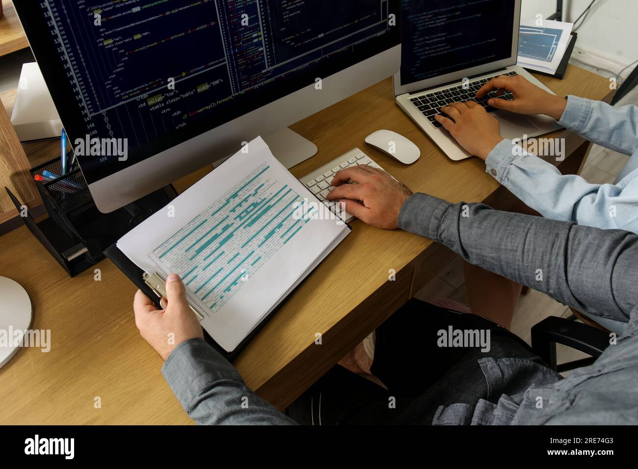 Male programmers working at table in office, closeup Stock Photo