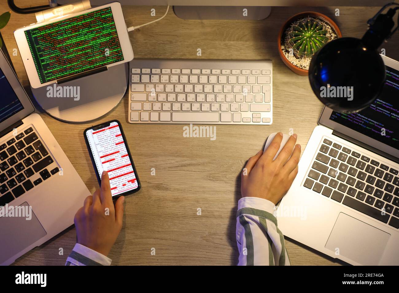 Female programmer working in office at night, top view Stock Photo - Alamy