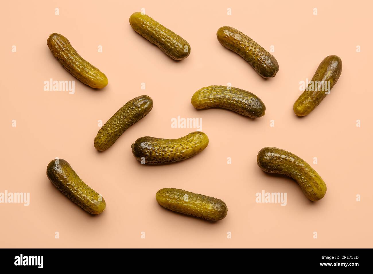 Pickled cucumbers on orange background Stock Photo