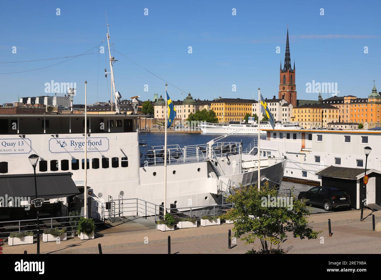 Stockholm, Sweden - July 24, 2023: The Rygerfjord hotel and hostel ship at the Sodermalarstrand with Riddarholmen island in the background. Stock Photo