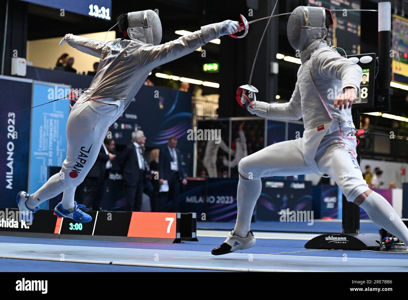 Kento Yoshida of Japan (L) fights against Oh Sanguk of South Korea