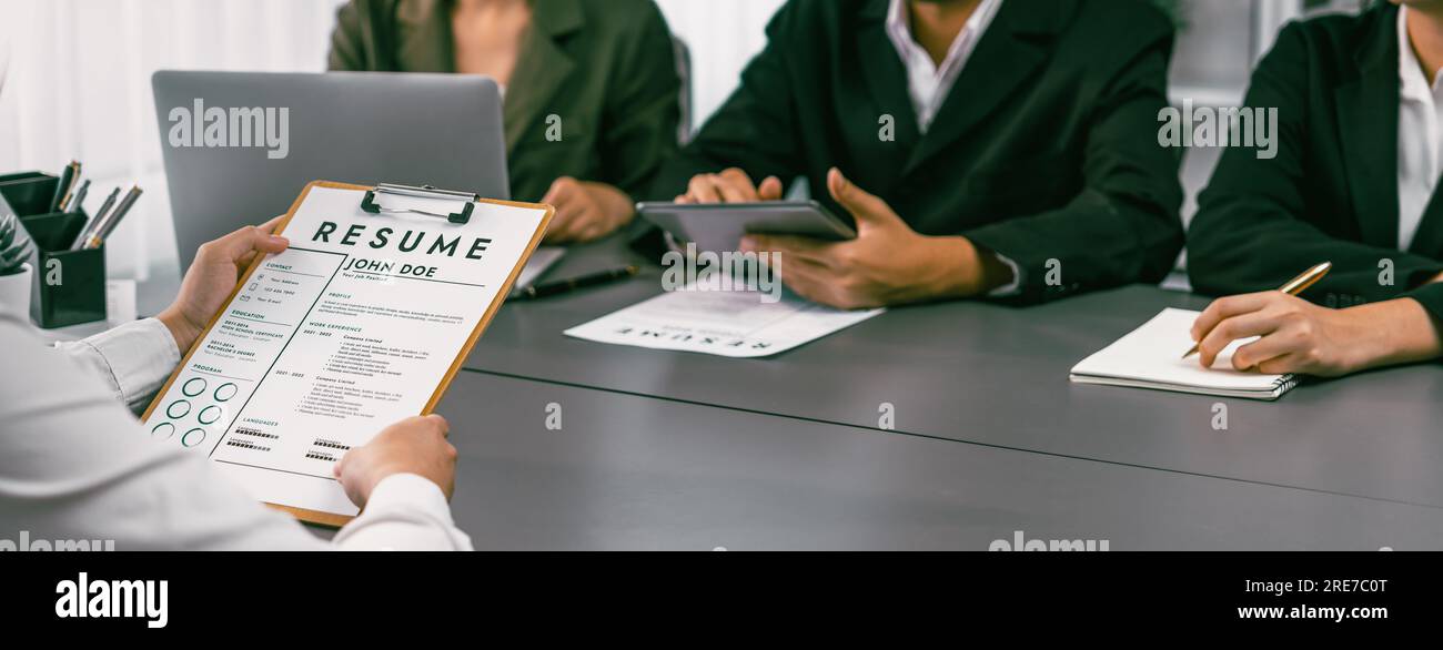 Candidate and interviewers discuss work experience and qualifications