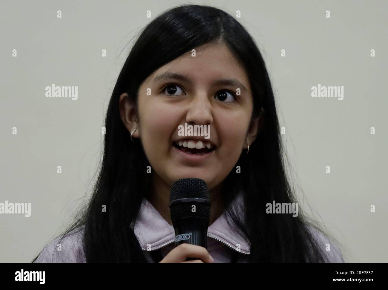 Emma Ramos, instrumentalist, during a press conference prior to a general rehearsal of the Orquesta Sinfonica Infantil de Mexico, at the Hotel Mision La Muralla, located in Amealco de Bonfil, Queretaro, on the occasion of the 31st National Tour in Mexico, which each year brings together around 147 young musicians who, through a call for applications, participate to form part of this orchestra and who are proficient in one of the following orchestral instruments: violin, viola, cello, double bass, flute, piccolo, oboe, English horn, clarinet, bassoon, horn, trumpet, tenor trombone, bass trombon Stock Photo