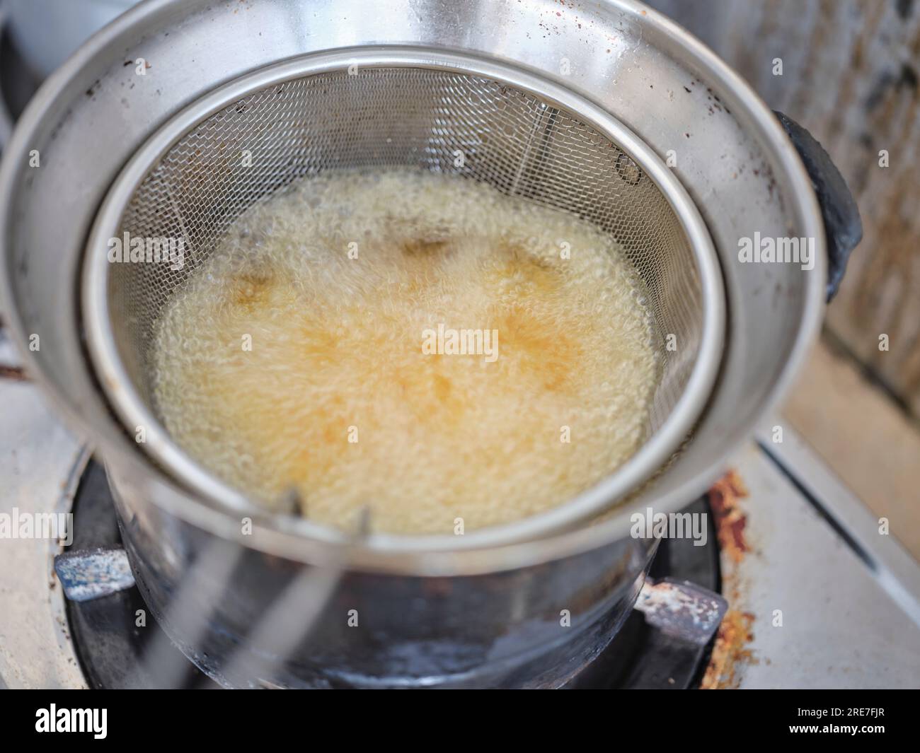 French fries in a deep fryerin hot oil . Preparation of french fries