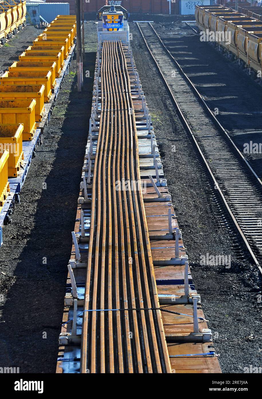 Steel railway tracks on top of transport carriages prior to