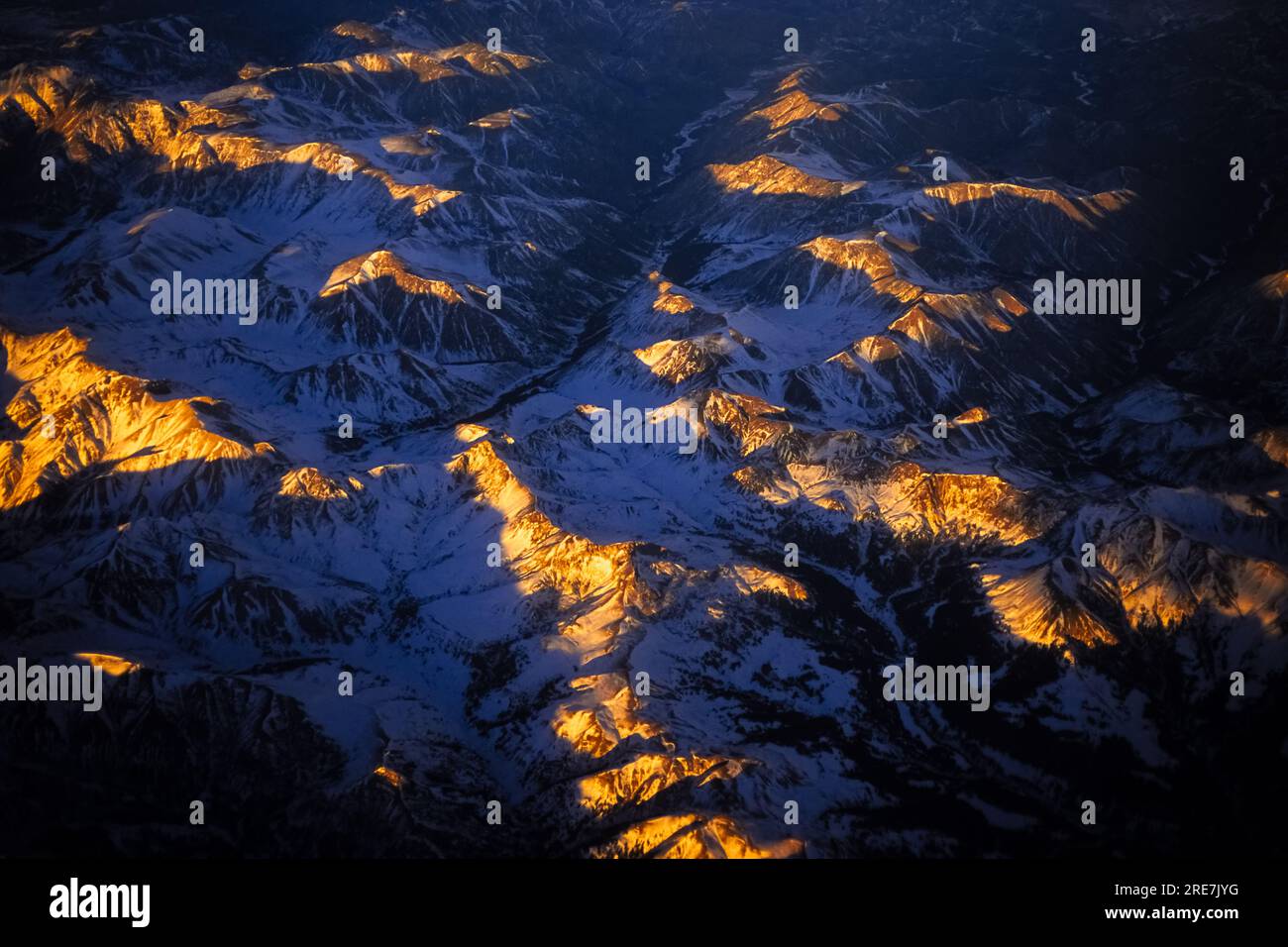 The Absaroka Mountains, part of the Continental divide on the Winter Solstice, from a United Airlines flight, Wyoming, USA. Stock Photo