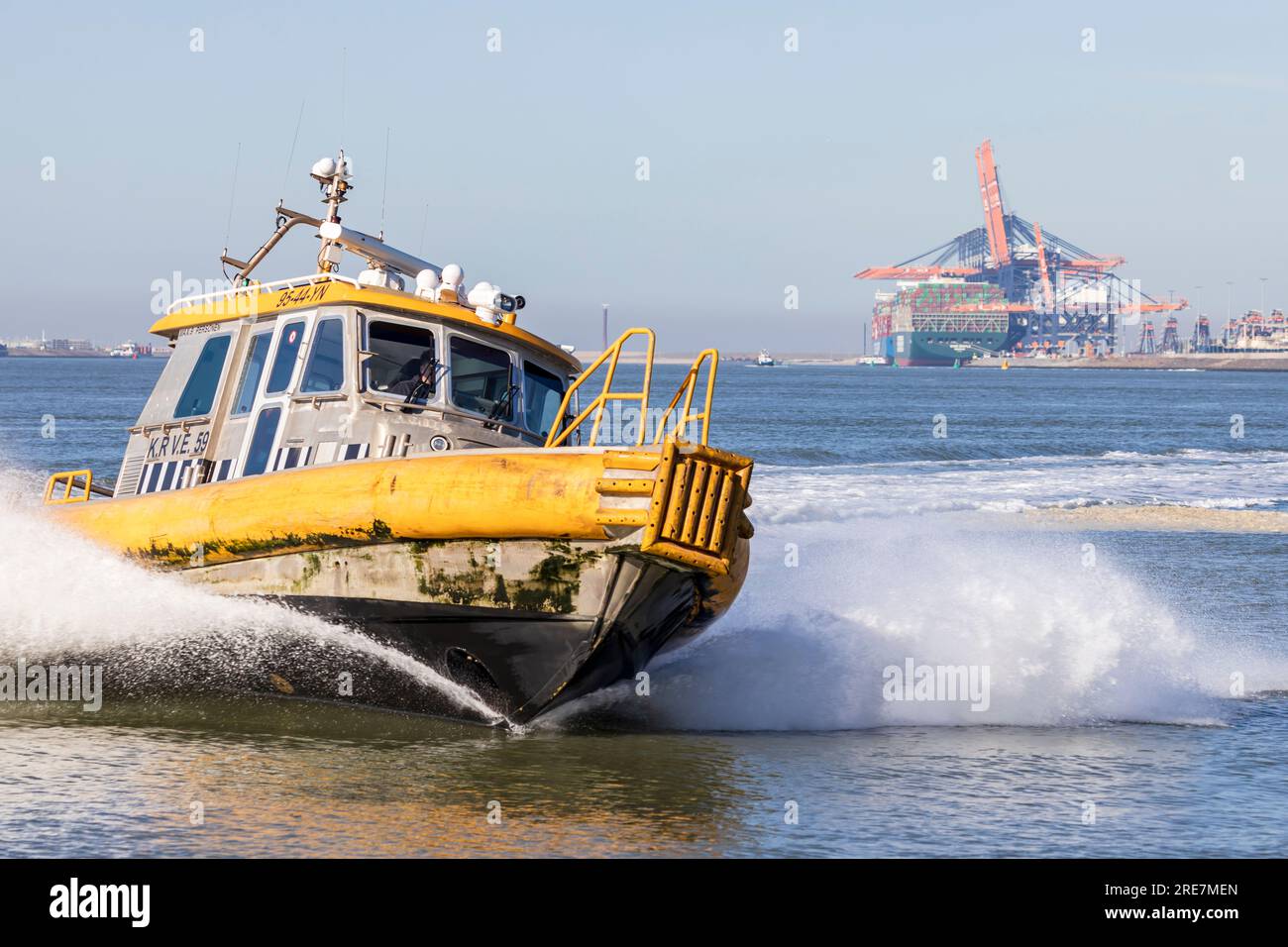 Rotterdam, the Netherlands - 2022-02-26: A small vessel of KRVE boatsmen service in the port of Rotterdam at high speed Stock Photo