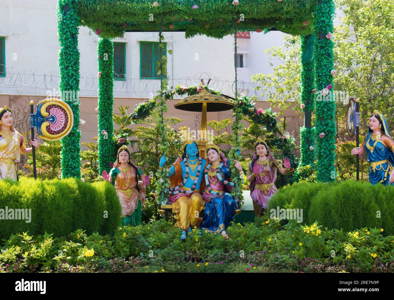 Colorful life size idols of Krishna, Radha sitting and swing at Prem Mandir temple. Happy Krishna Janmashtami. selective focus on subject. Stock Photo