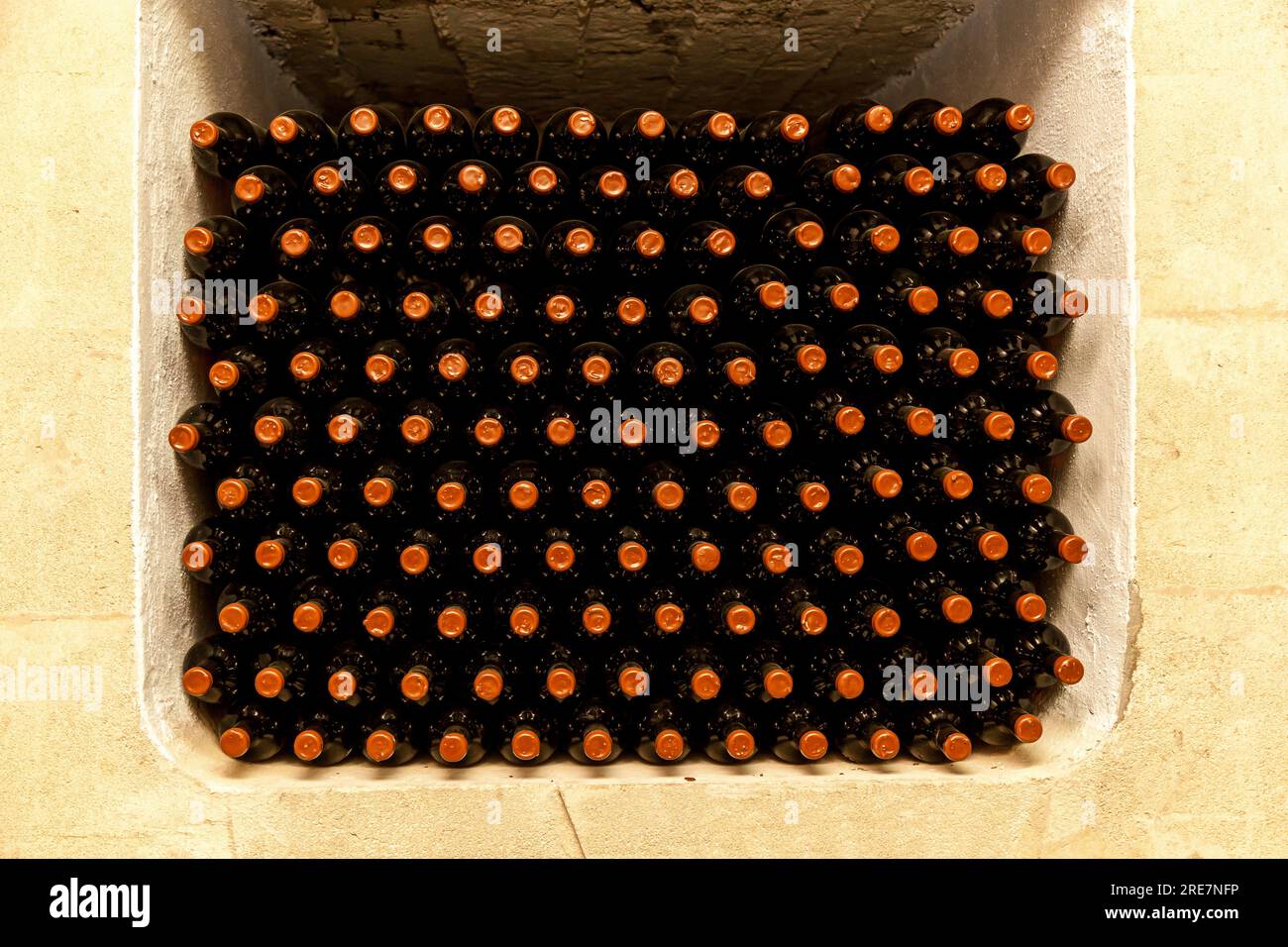 Old bottles of wine stacked in rows in the cellars of a winery Stock ...