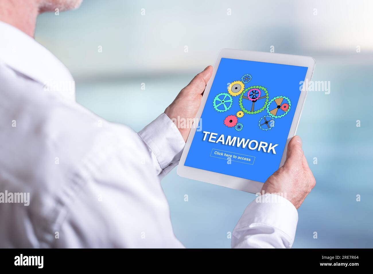 Tablet screen displaying a teamwork concept Stock Photo