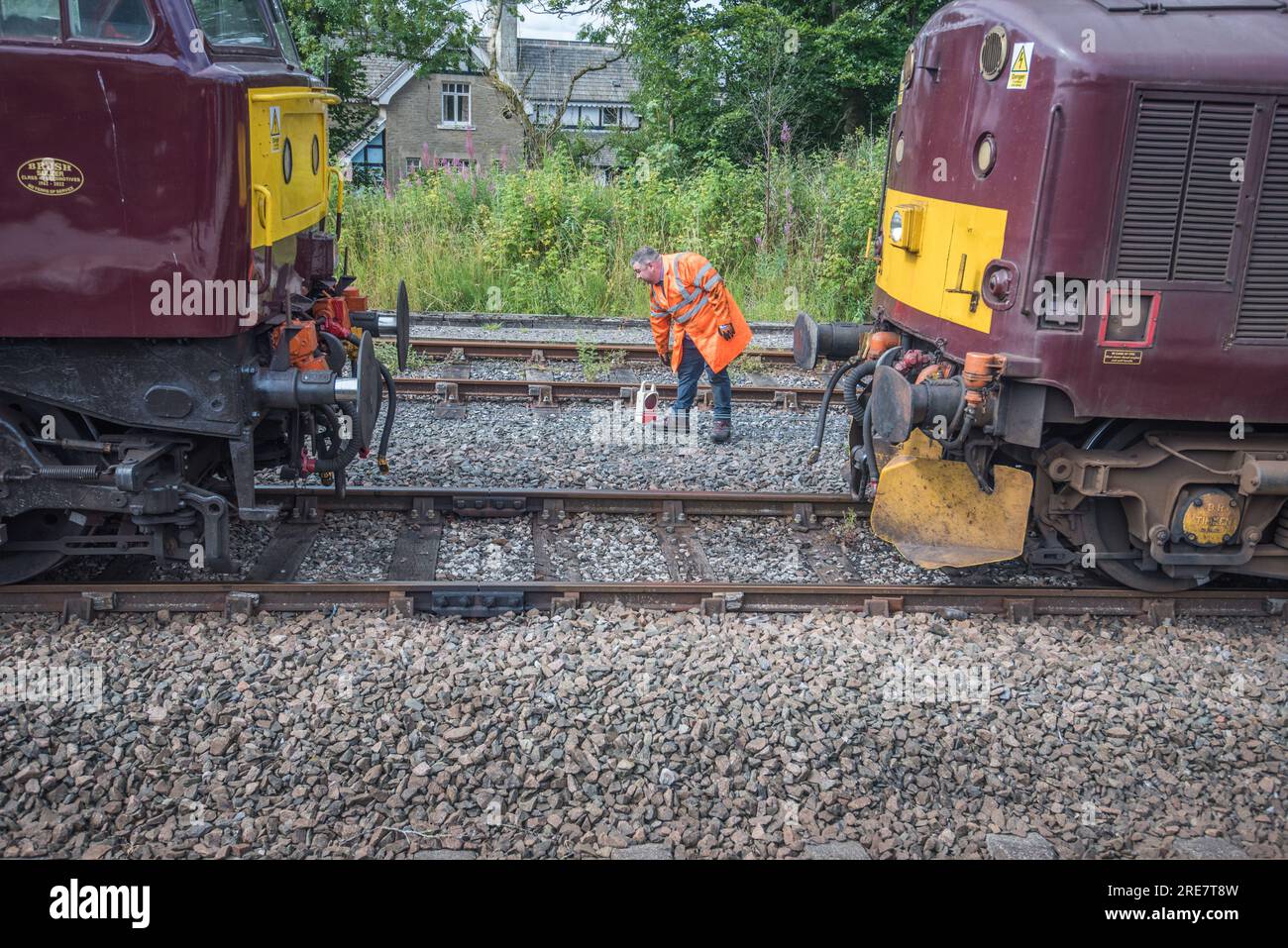 Diesel 'Chris Fudge' linking up to unnamed WCR 37706 diesel loco in WCR 'claret' livery,at the rear of Sierra Leone steam train 25th July 2023. Stock Photo