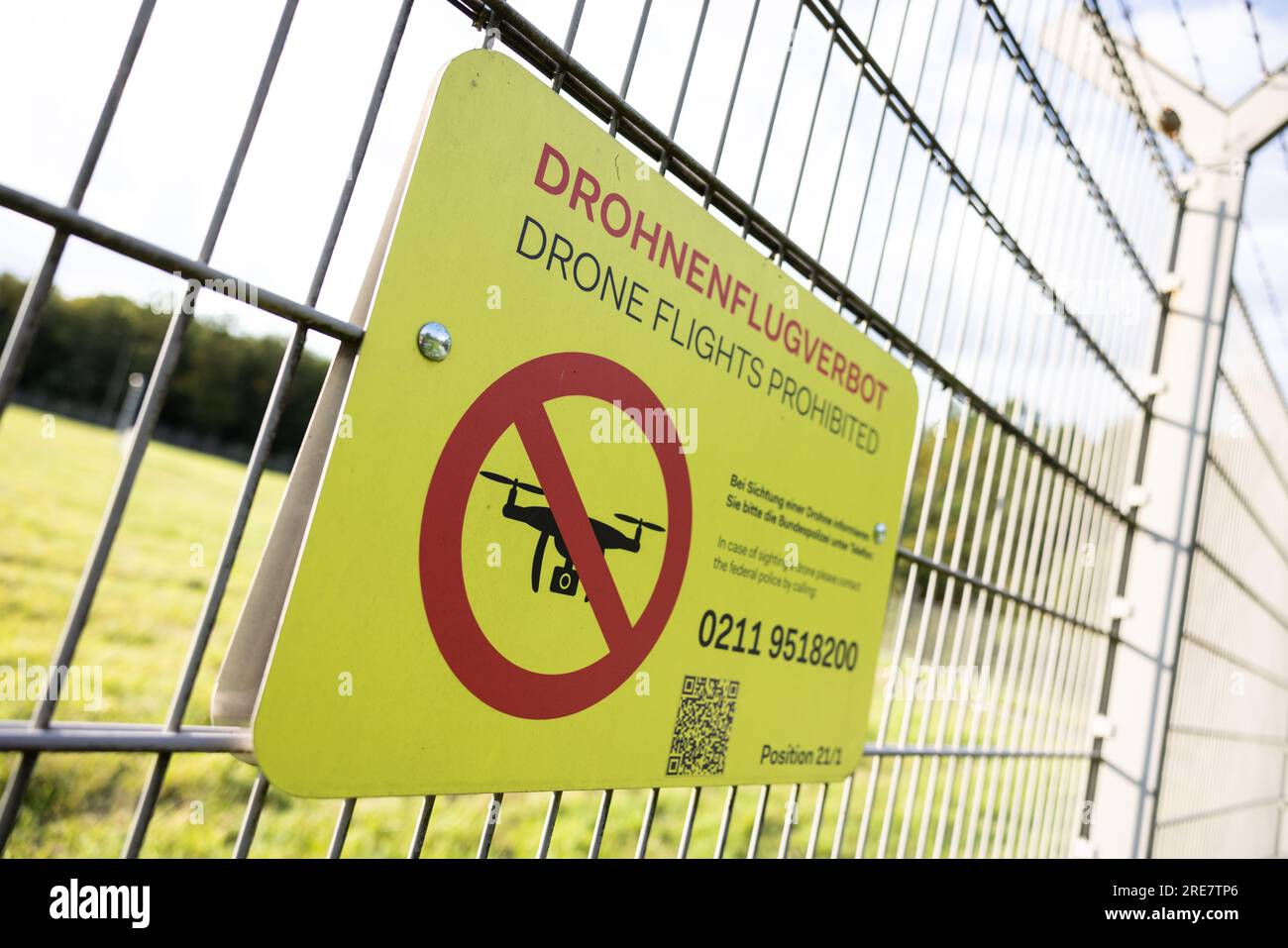 'Drone flights prohibited' is written down on a is written on a fence at duesseldorf airport. Stock Photo