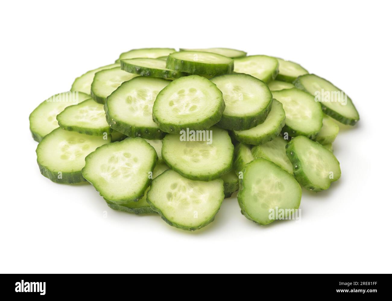 Heap of fresh sliced cucumbers isolated on white Stock Photo
