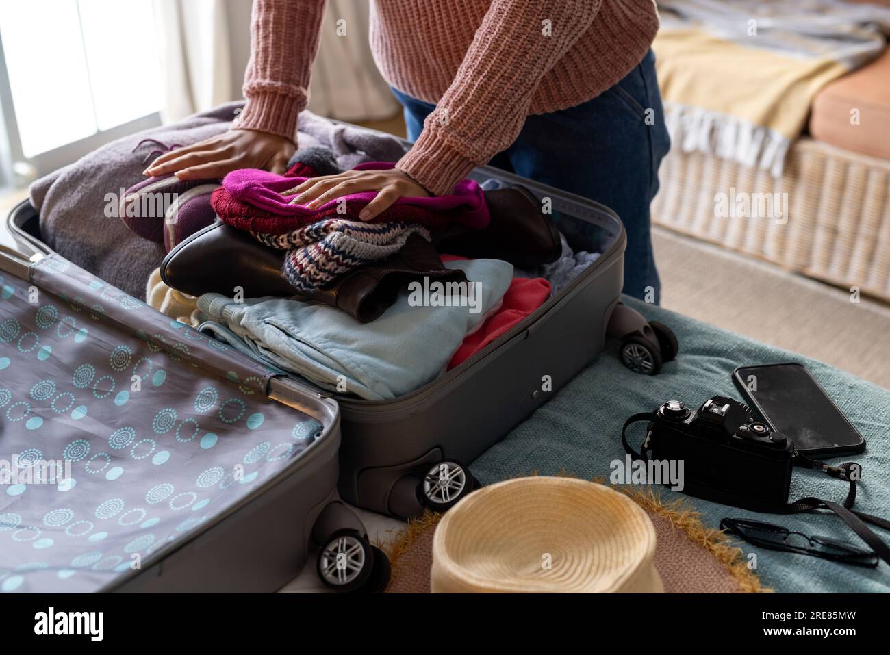Calm woman packing luggage in bedroom · Free Stock Photo