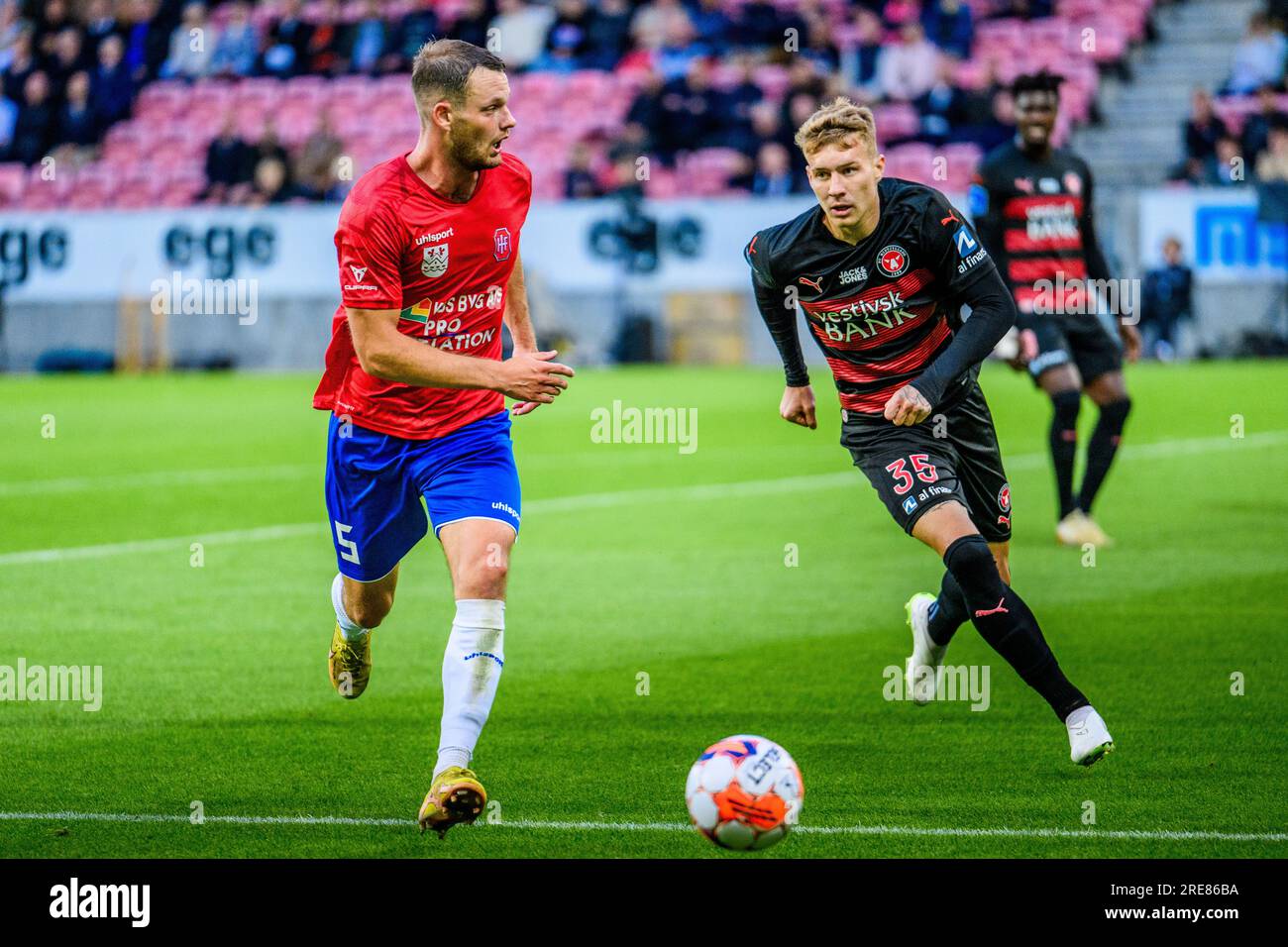 Herning, Denmark. 21st, July 2023. Matti Olsen (5) of Hvidovre IF and Charles (35) of FC Midtjylland seen during the 3F Superliga match between FC Midtjylland and Hvidovre IF at MCH Arena in Herning. Stock Photo