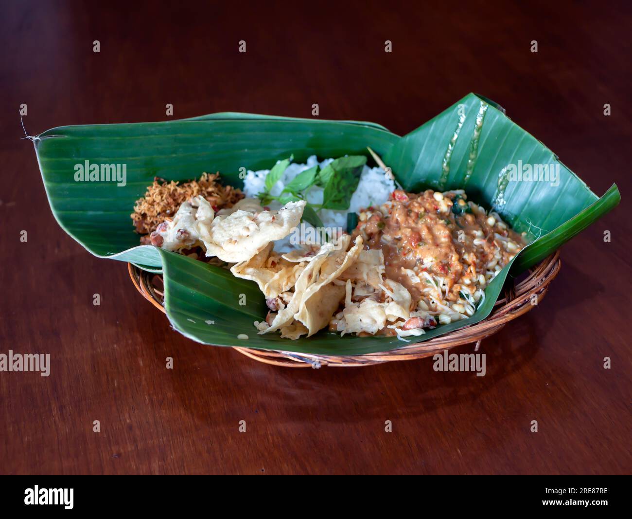 Pecel Pincuk, a Javanese traditional food, served on banana leaves, one of the environmentally friendly food packages. Stock Photo